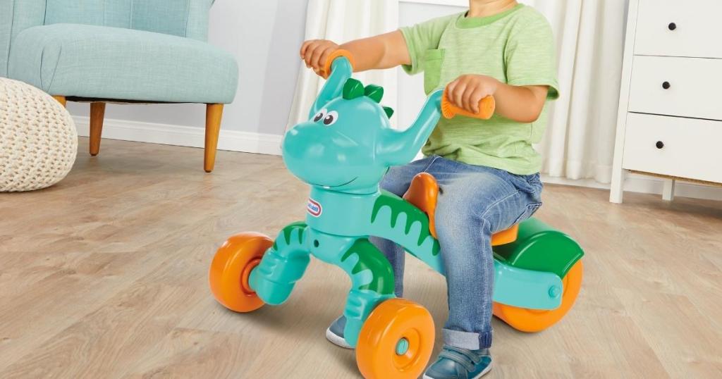 child riding dino little tikes toy