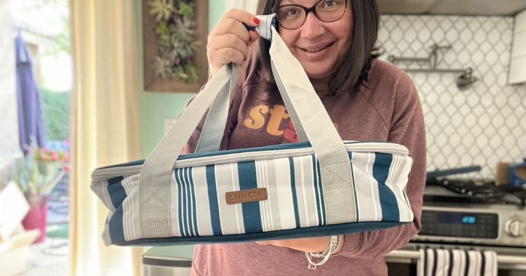 woman holding a casserole carrier