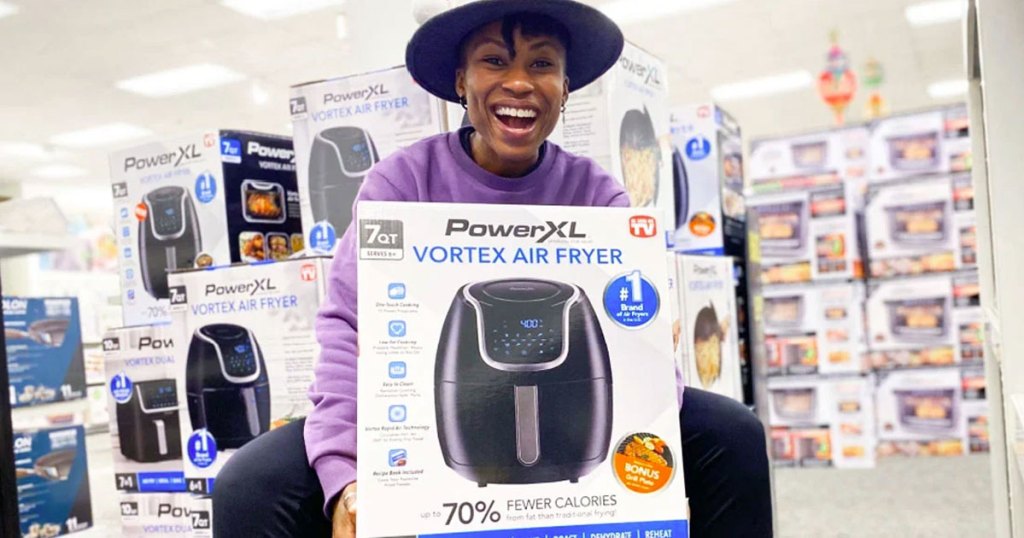 woman holding powerXL air fryer box