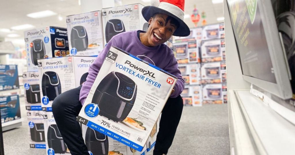 woman holding powerxl vortex air fryer