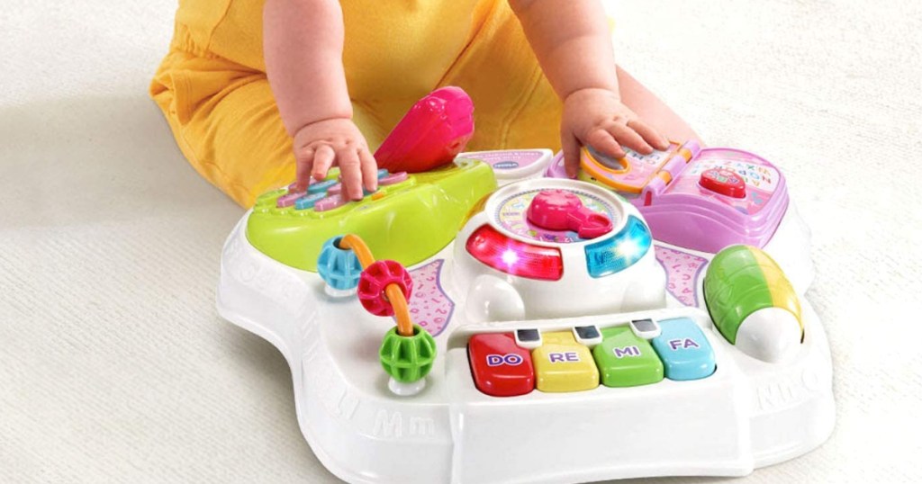 Baby playing with Sit-to-Stand table