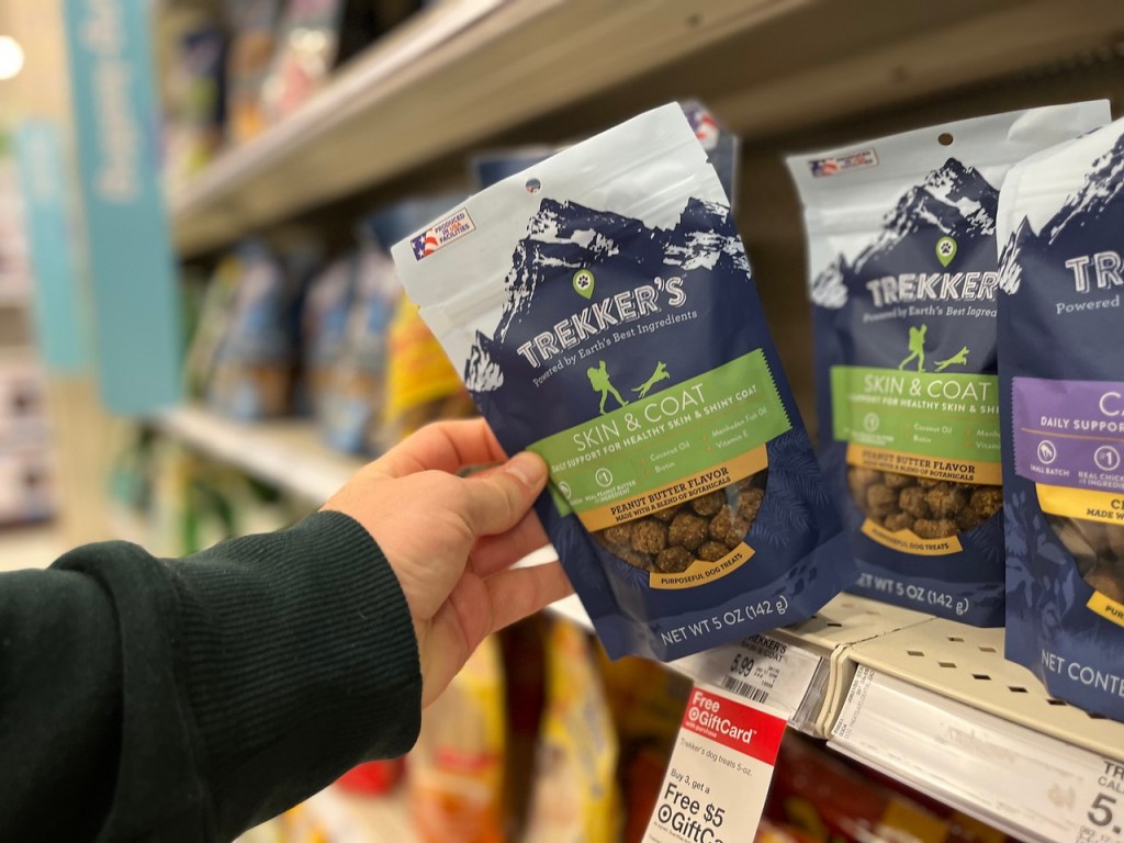 hand pulling Trekker's Dog Food off shelf