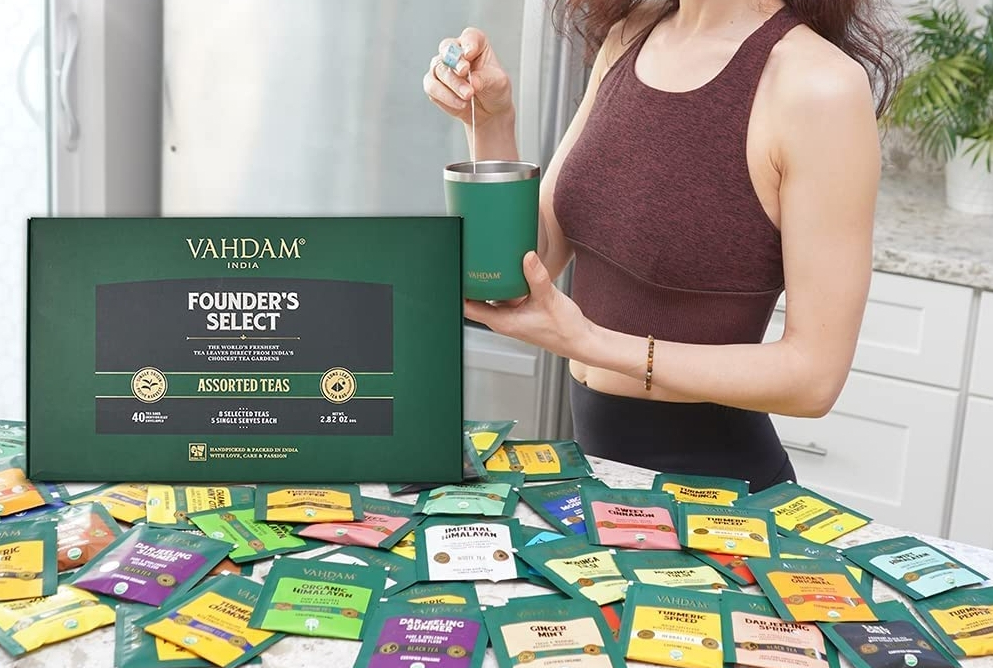 woman standing by a VAHDAM Tea Sampler