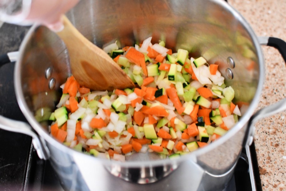 cooking veggies in butter on the stove