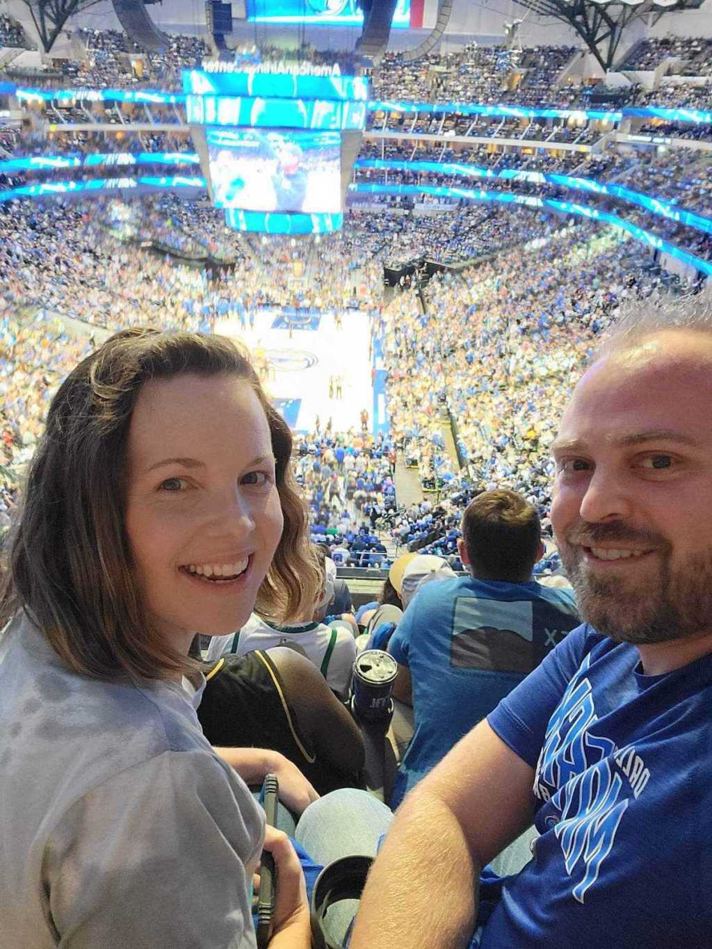 couple sitting at basketball game 