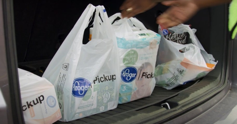 Kroger grocery bags in the back of a vehicle