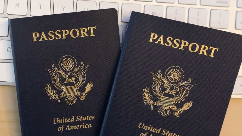 two passports on onlineputer keyboard