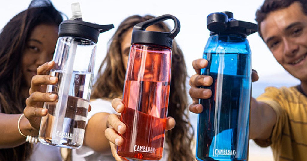 two women and man holding different colored reusable water bottles