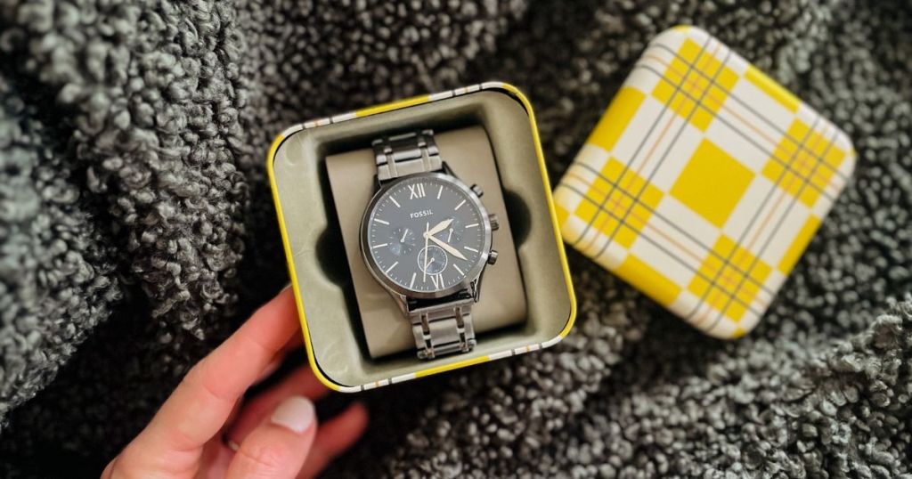 box with Fossil watch placed in it