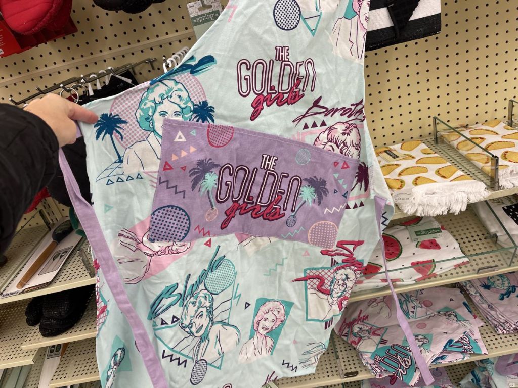 hand holding a Golden Girls Pastel Apron