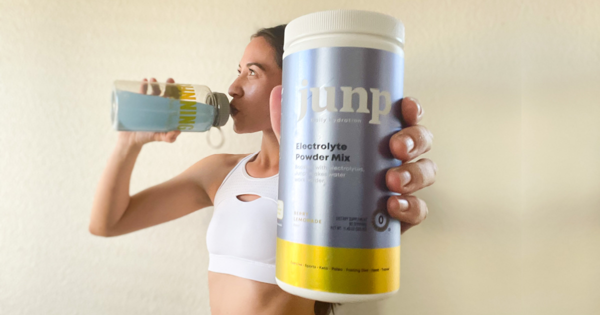 Woman holding canister of electrolyte mix