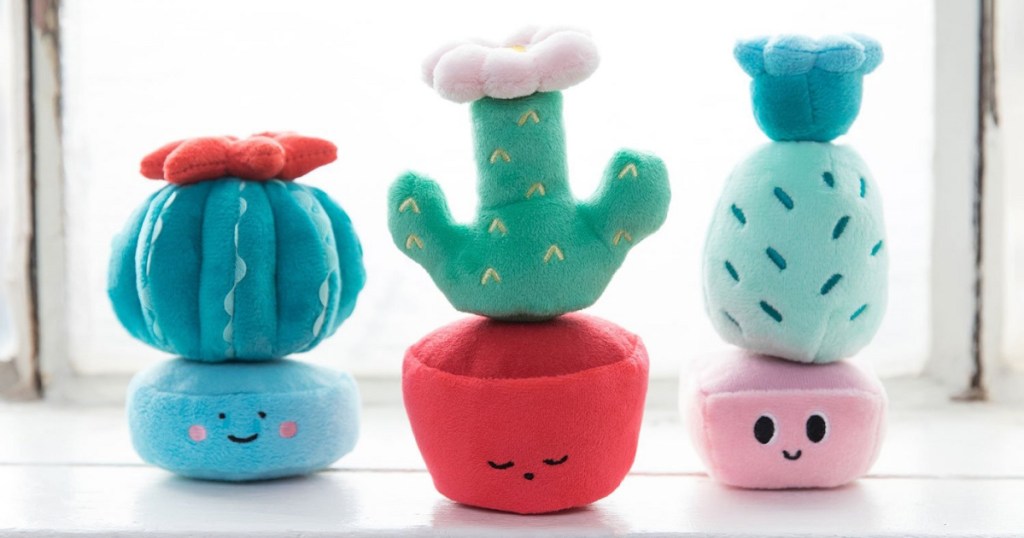 plush cactus stacking set near windowsill