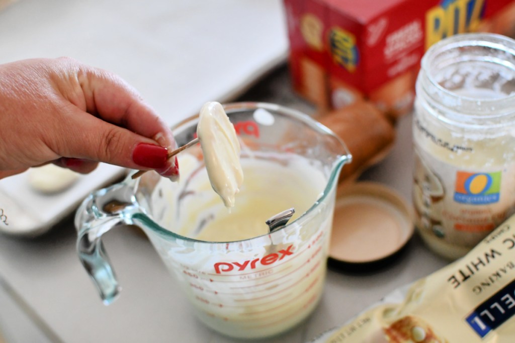 dipping ritz crackers in white chocolate