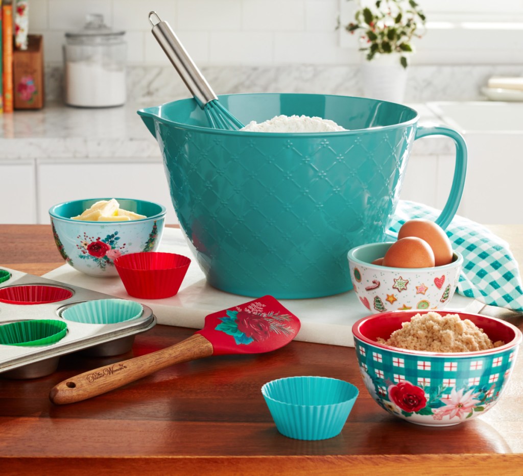 display of The Pioneer Woman Silicone Kitchen Utensils & Mixing Bowl 14 Piece Set on a table