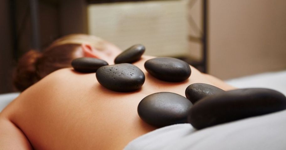 woman getting a hot stone massage