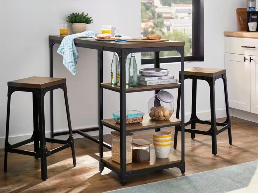 black and brown metal dining table and two stools