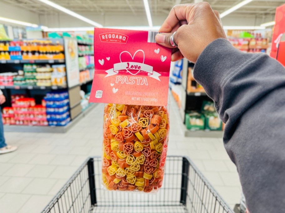 hand holding heart shaped pasta bag