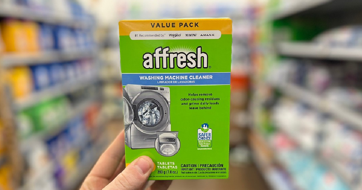 Affresh Washing Machine Cleaner in a man's hand