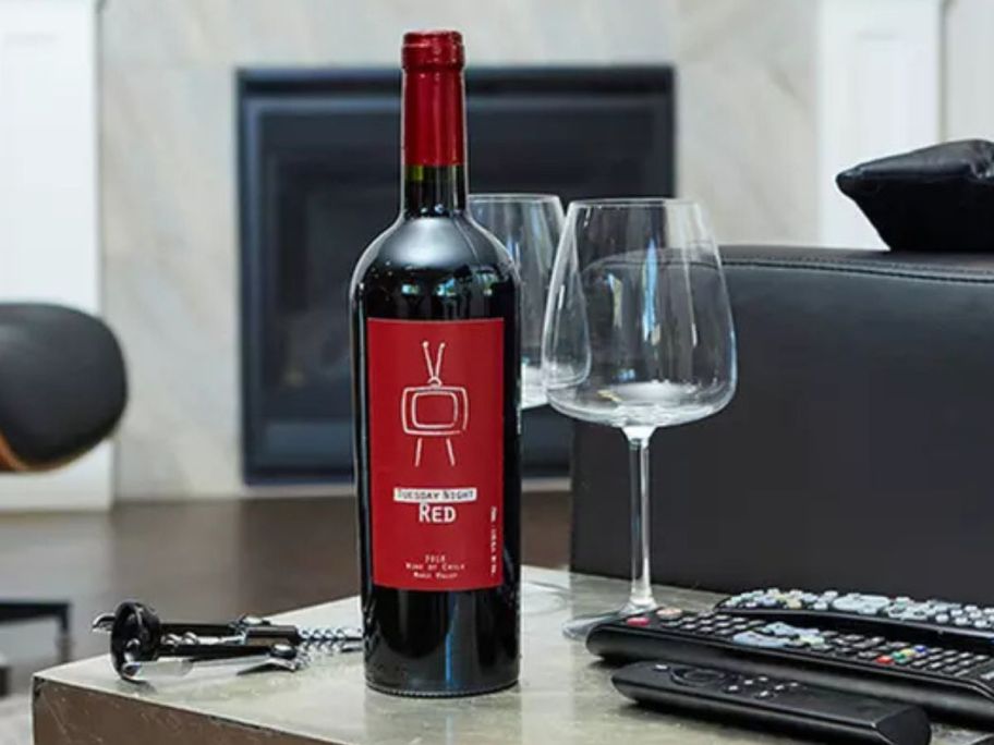 A Bottle of Cabernet on a table next to red wine glasses