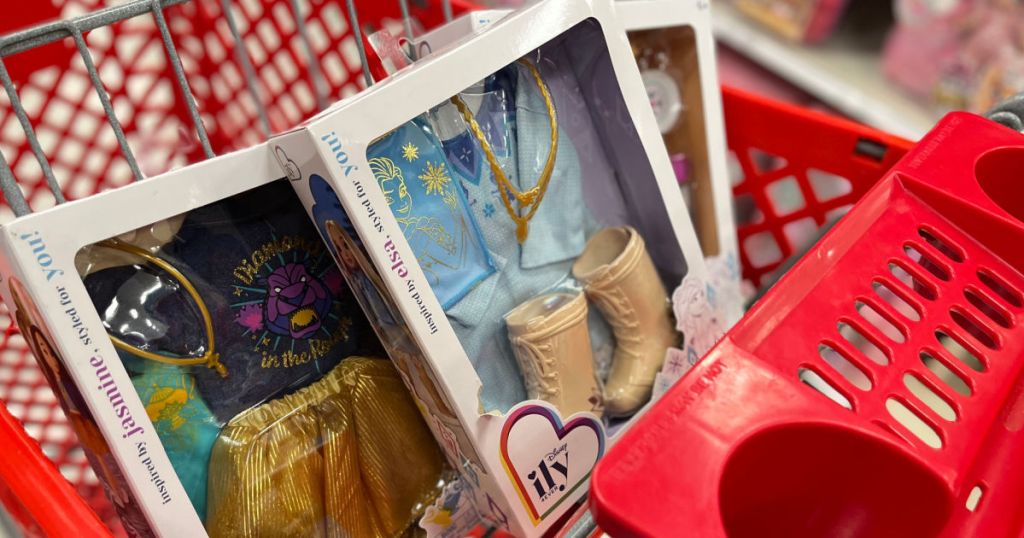 doll clothing in boxes in front of red cart 