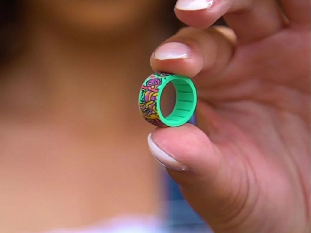 hand holding silicone ring between pinched fingers