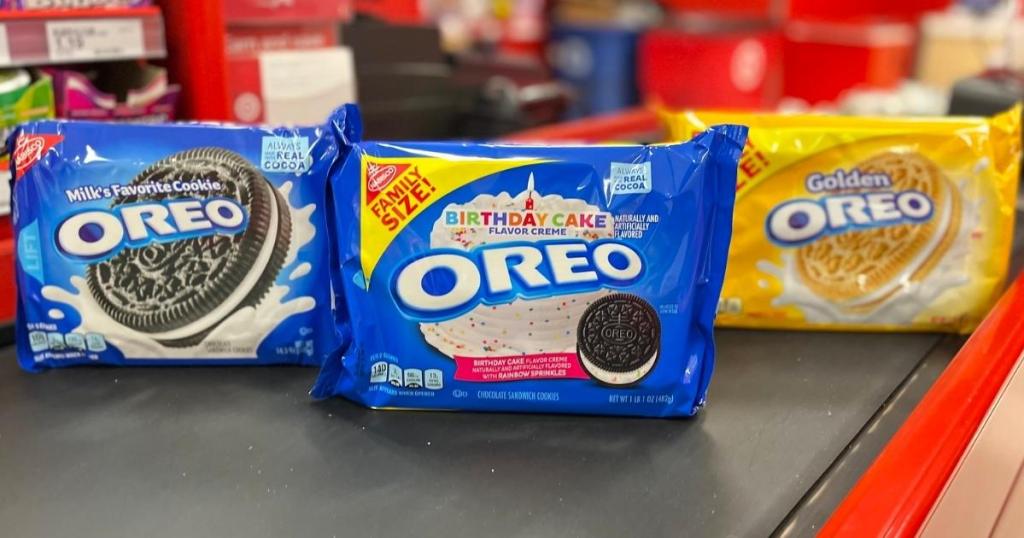 three packages of oreo cookies on shelf