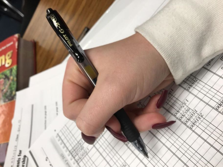 hand holding a pen