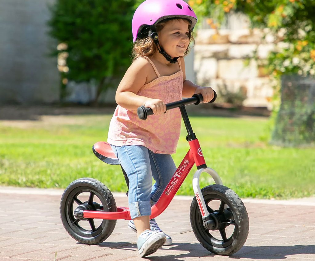 girl on a SmarTrike Balance Bike