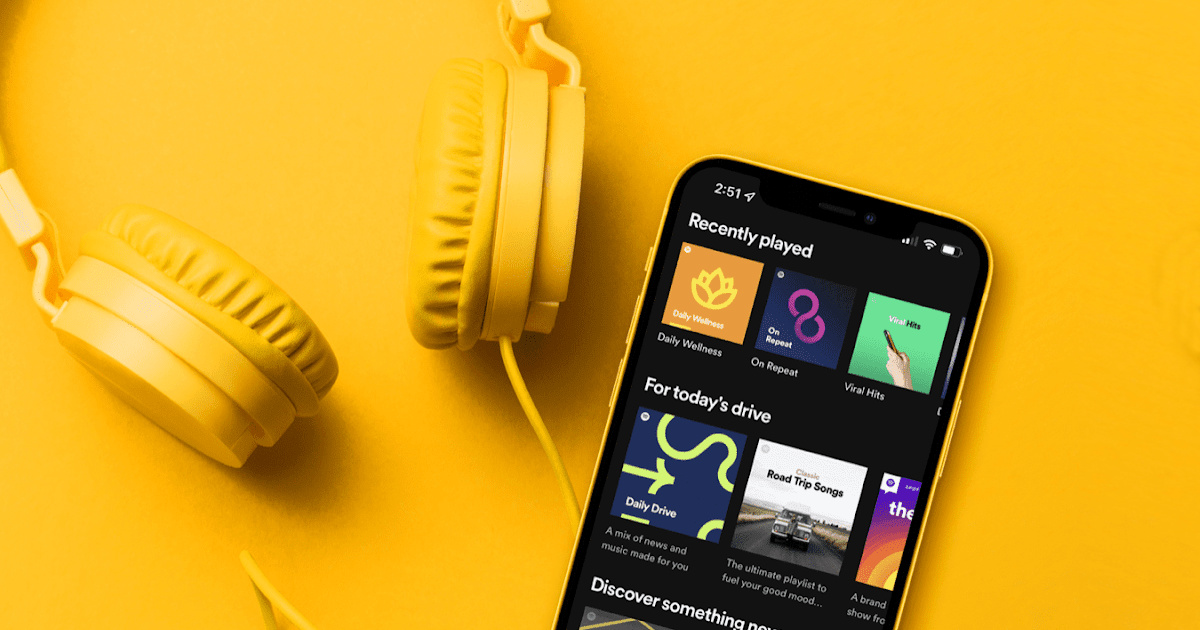 spotify displayed on yellow wall