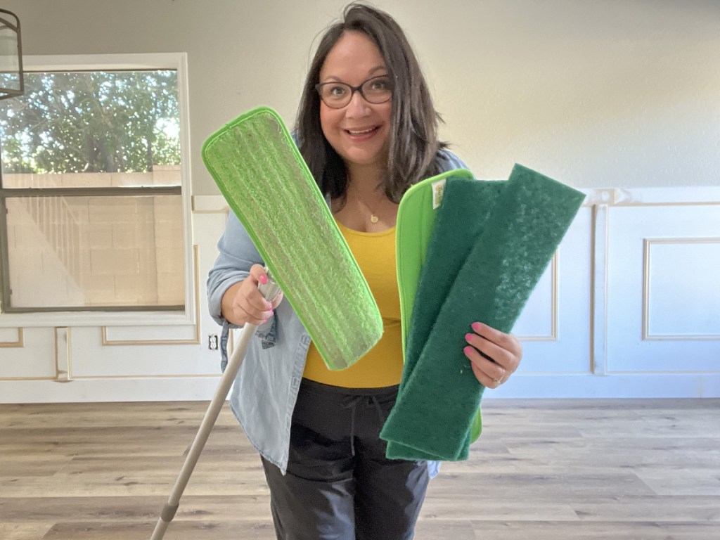 Woman holding Turbo Mop and pads