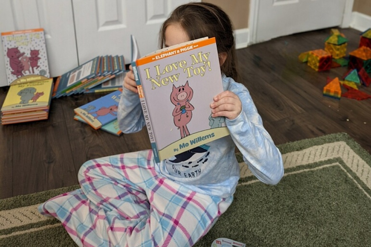 child reading book