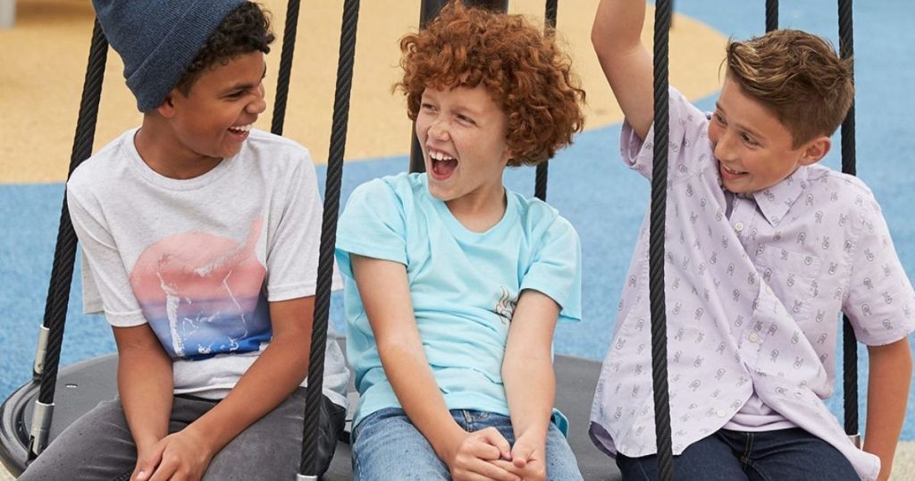 boys sitting on swing