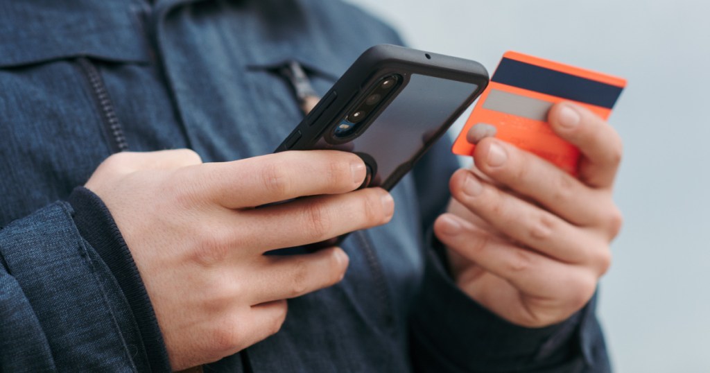 man on phone and credit card