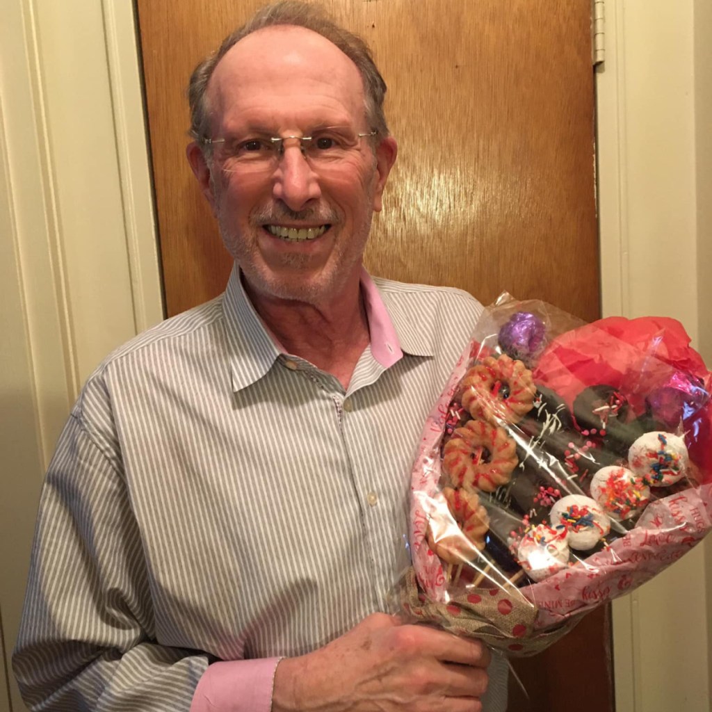 man with donut bouquet