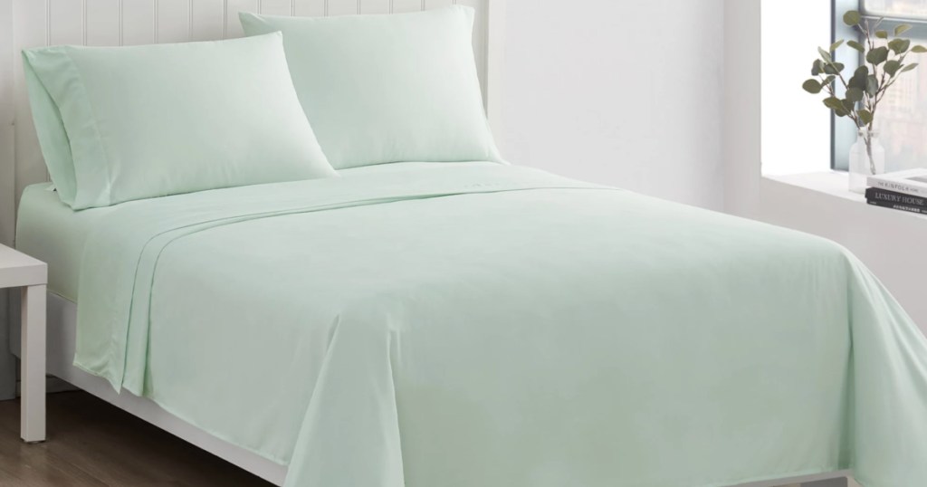 mint sheet sets on bed