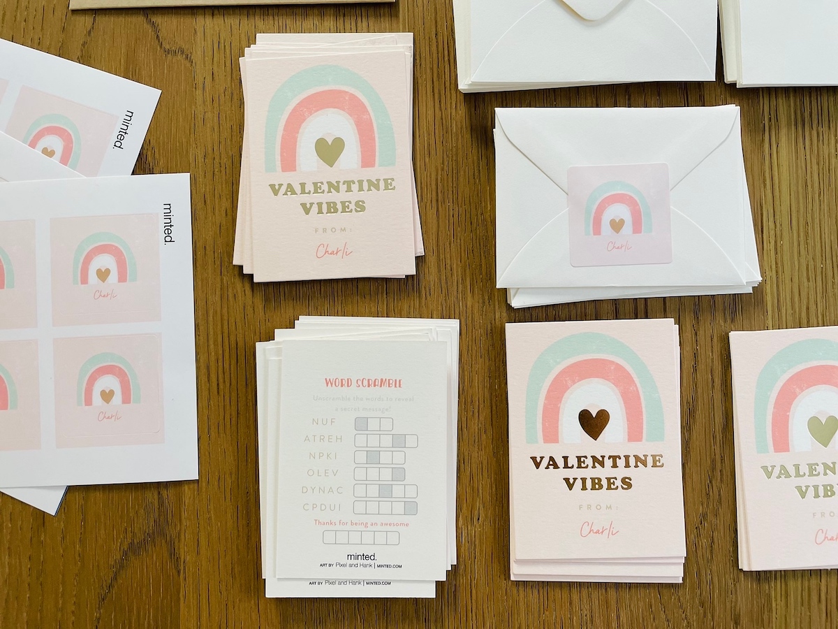 valentines day cards laid out on wood table