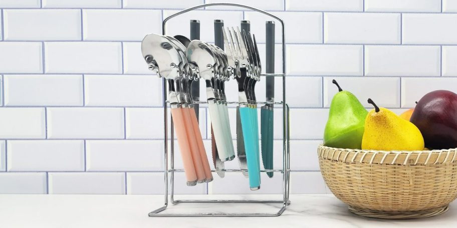 blue, white, and pink flatware in storage on counter