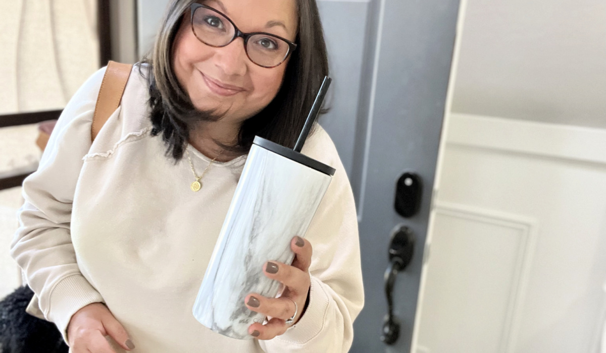 woman holding simple modern tumbler