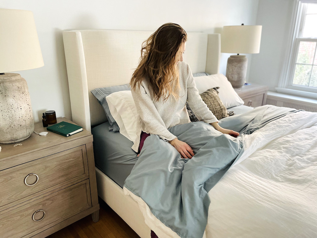 woman in bed with luxury walmart bedsheets 