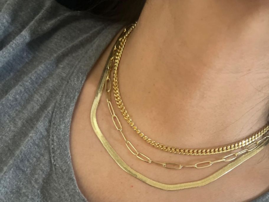 woman wearing a 3-Piece Gold Necklace Set