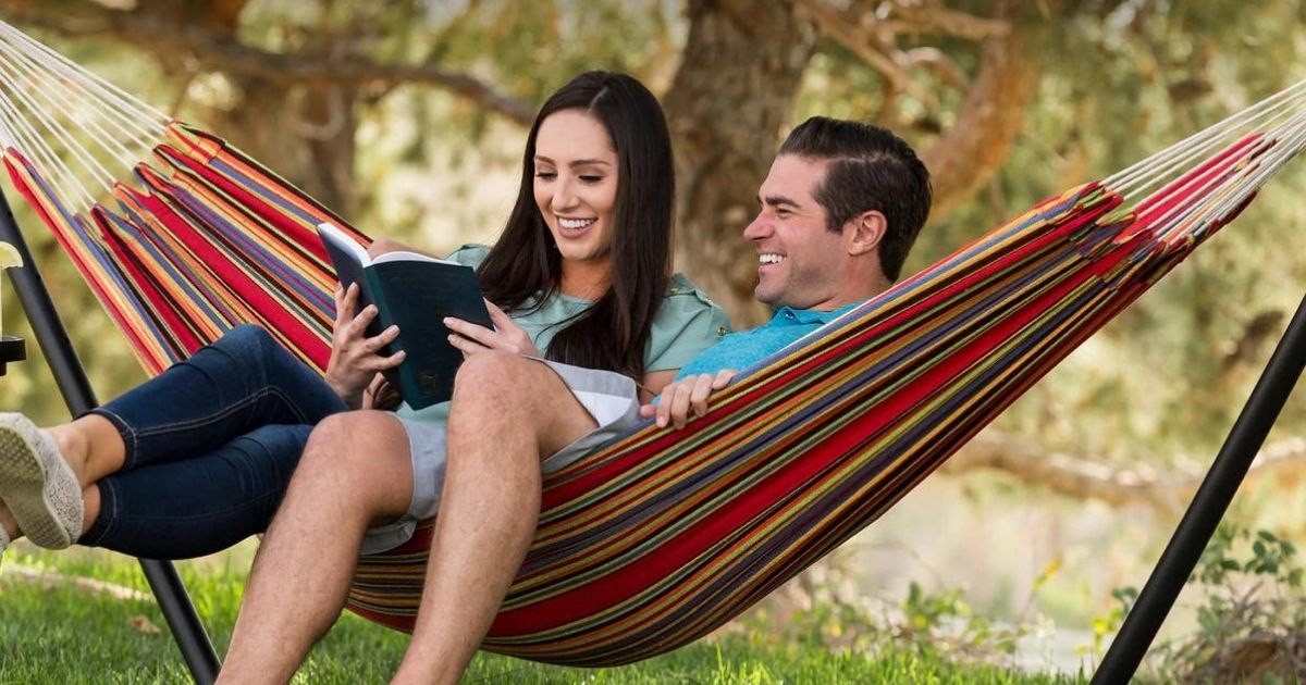 two people sitting in a hammock