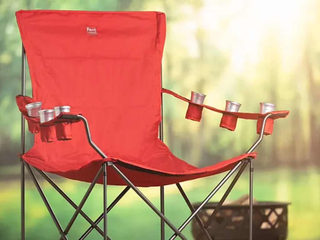 red giant chair with drinks in each cupholder