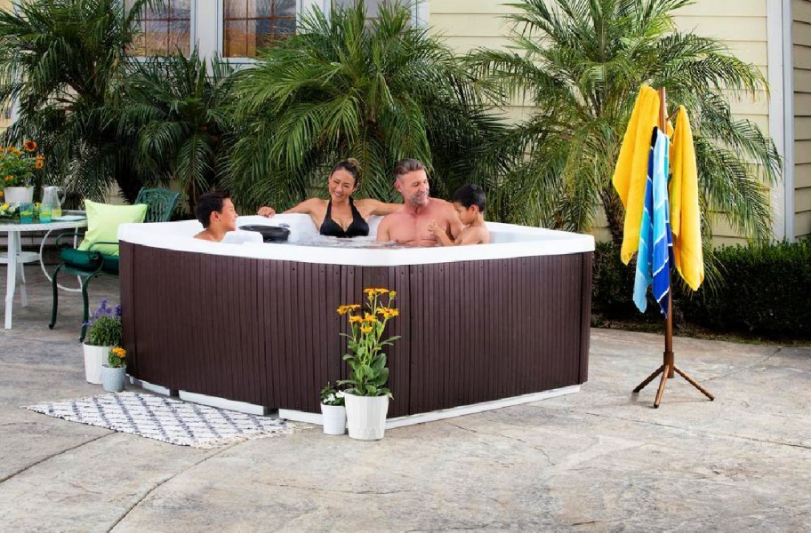 family in a brown hot tub