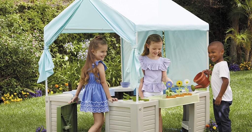 kids playing in Little Tikes Bungalow