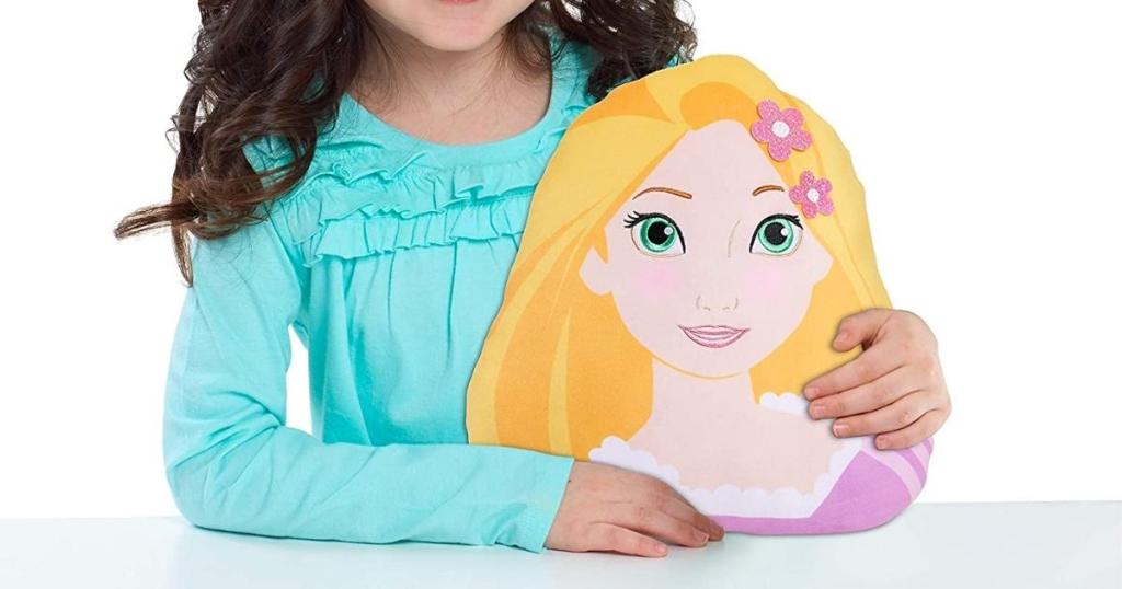 young girl with Disney Princess Rapunzel Character Pillow