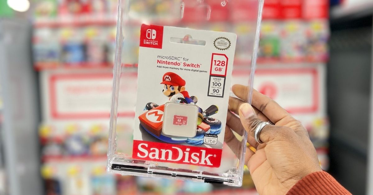 hand holding a Sandisk Memory Card