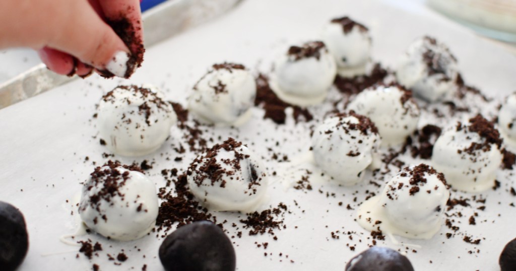 adding crushed oreo sprinkles to oreo balls