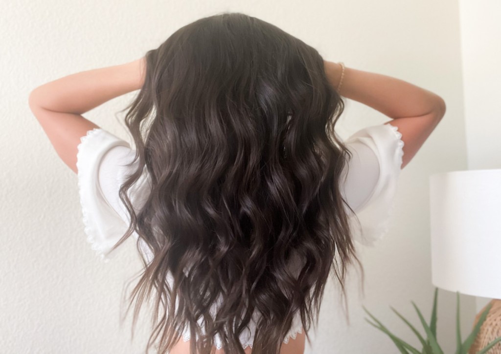 back of woman's head with beach waves