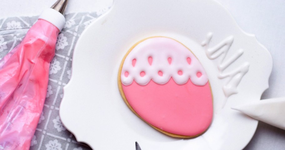 craftsy easter egg cookie on a platter with frosting around it