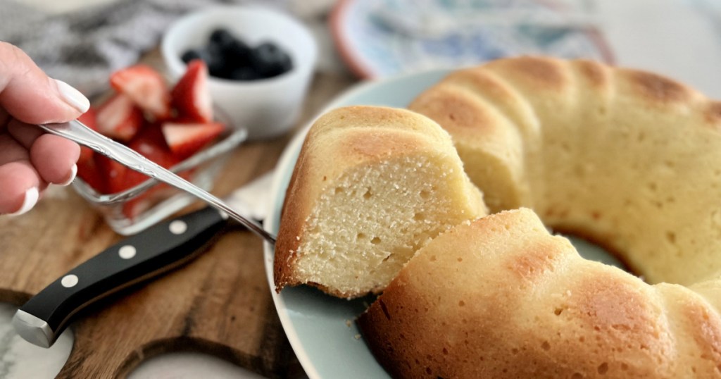 cutting a slice of pound cake